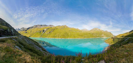 Turquoise Lac Moiry lake with dam in Valais mountains in Switzerlandの写真素材