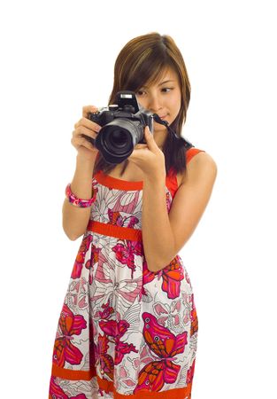 beautiful asian woman with a digital camera, isolated on whiteの写真素材