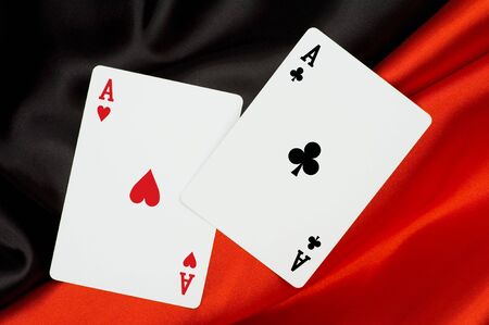 2 aces on red and black shiny silk