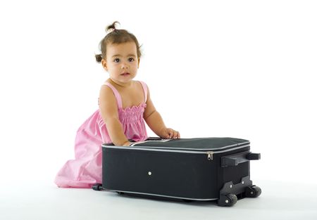 cute little girl with luggage, isolated on whiteの写真素材