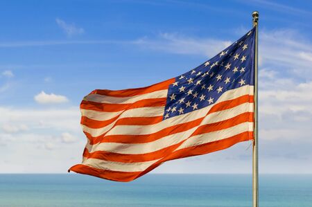 us flag against horizon over waterの写真素材