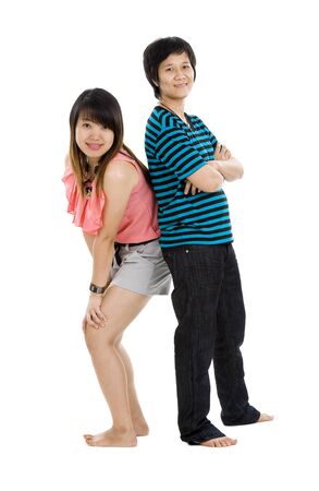 two young asian women posing over white backgroundの写真素材