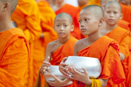 Bangkok, Thailand  July 7, 2012: Alms giving-ceremony - Thousands of monks celebrate the enlightenment of Siddhartha Gautama, which dates back 2600 years agoのeditorial素材