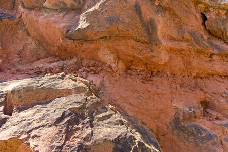 Stone texture and background. Rock texture. The Enormous face Aging and Divided by Huge Cracks and...