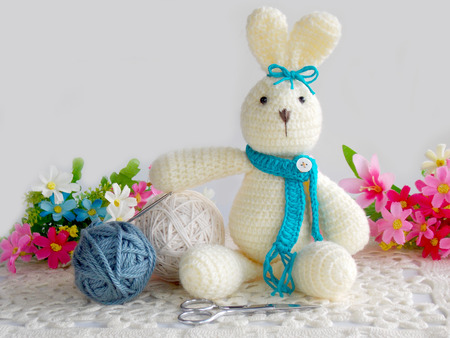 Crochet rabbit doll on white backgroundの写真素材