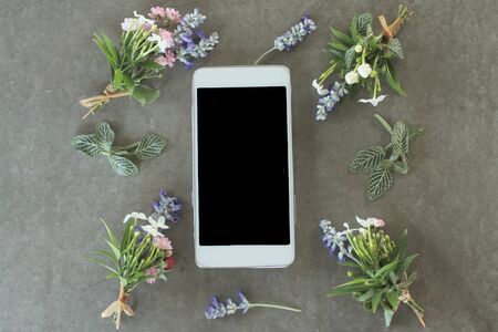 Lovely boutonniere with mobile phone.の写真素材