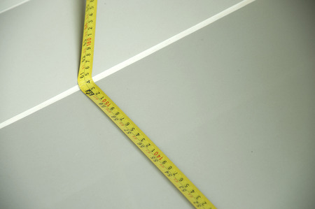 Worker use cartridge meter measuring in construction siteの写真素材