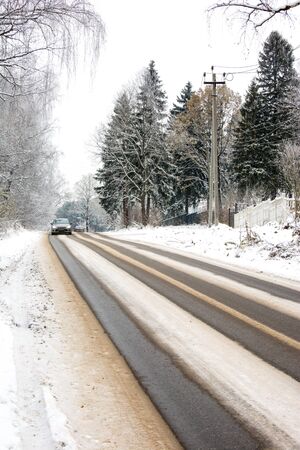 beautiful landscape, winter road among large firsの写真素材