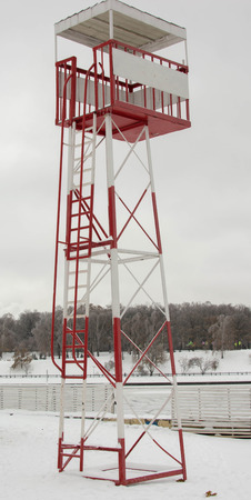 red white Rescue tower on empty snowy beach. Winter landscapeの写真素材