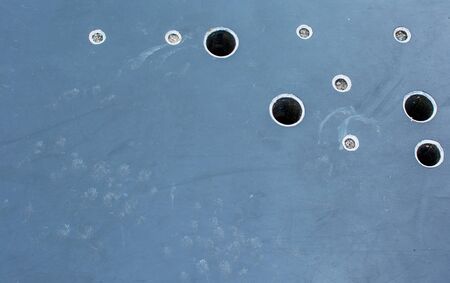 An unusual dark background with holes.の写真素材