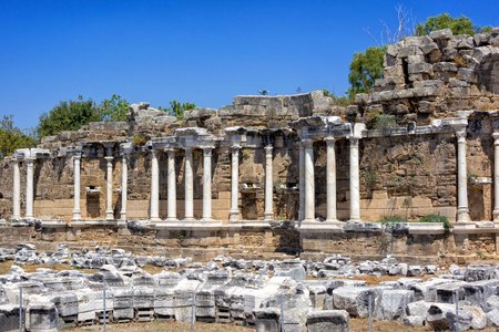 Fountain of Nymphaeus in Side, Turkey. Beautiful ruins of a great structure against the blue sky.の写真素材