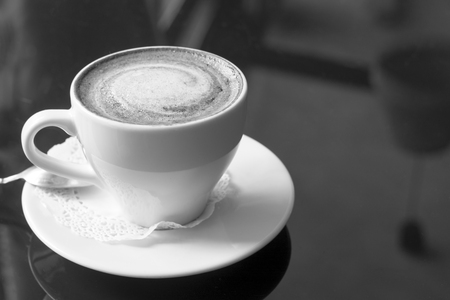 White mug with coffee. A fragrant cappuccino. An unusual tinted photograph with a bokeh.の写真素材