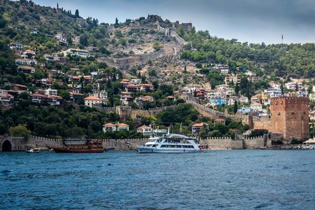 The coast of the sea. Beautiful cliffs over the blue . the wall of the fortress of Alanya, view from the sea.の写真素材