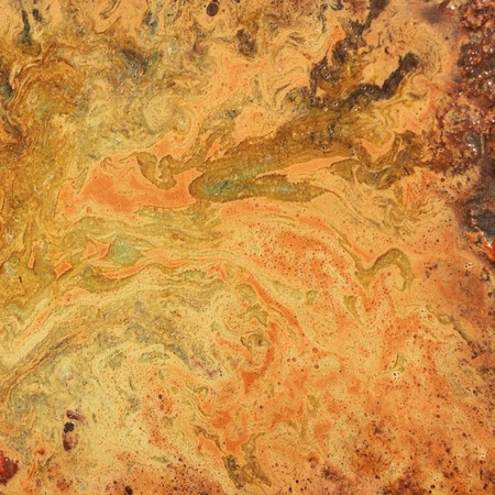 An unusual background with orange and red divorces. Blots and stains.の写真素材