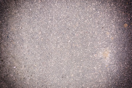 Blank background with vignette. Texture of granular asphalt.の写真素材