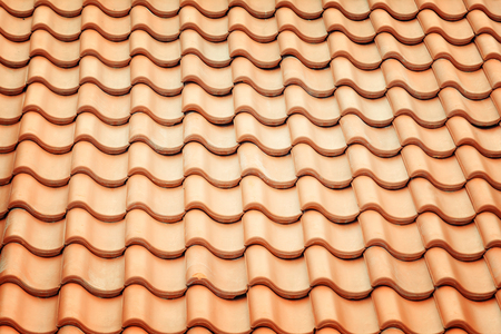 Background with texture. A roof with an even new tile.の写真素材