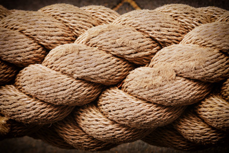 Thick rope close-up. Unusual background with vignette.