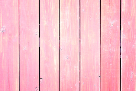 Fence of boards painted in pink. Light background with a texture of wooden slats.の写真素材