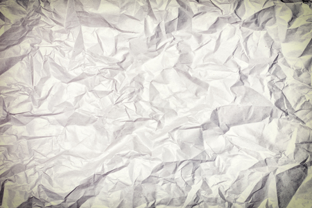 Texture of crumpled paper, background. Photo with vignette.の写真素材