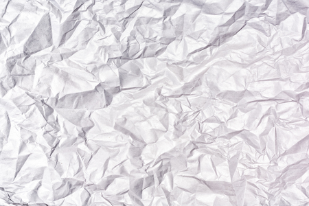Texture of heavily crumpled gray paper.の写真素材