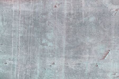 Old gray  with spots and bumps. Slate sheet texture close-up.