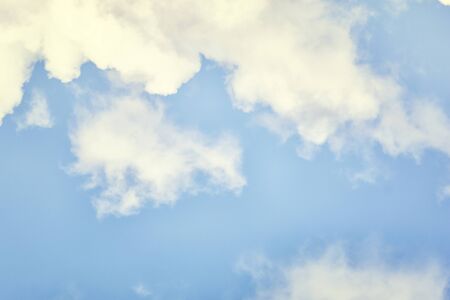 Beautiful photo of a blue sky with lots of white clouds. Abstract background for sites and layouts.の写真素材