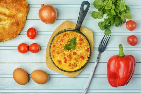 Freshly made omelet, Turkish national recipe  with eggs, bell pepper, onion and tomato.の写真素材
