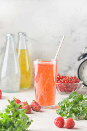 A glass of strawberry drink and basil seeds. Useful juice for diet or proper nutrition. Immune cocktail.の写真素材