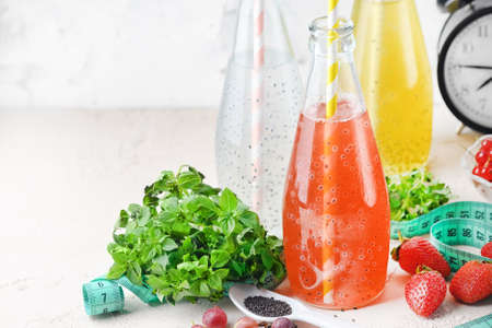 Three bottles of drinks with basil seeds. Useful juices for diet or nutrition. Immune cocktail. Copy space.の写真素材