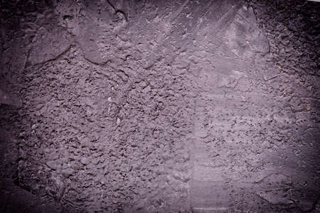 Dark background for atmospheric layouts. Wall with uneven plaster.の写真素材