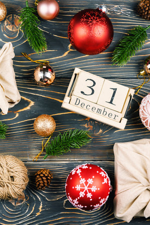 New Year composition with Christmas balls and calendar. Gifts wrapped in cloth, Zero Waste.の写真素材