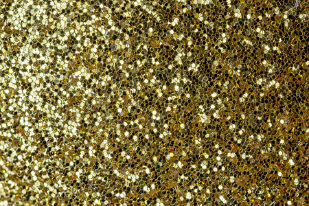 Shiny background for layouts and websites. Gold sequins close up.の写真素材