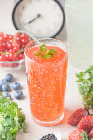 A healthy, non-alcoholic drink made with basil seeds. Currant juice in a transparent glass. Diet foodの写真素材