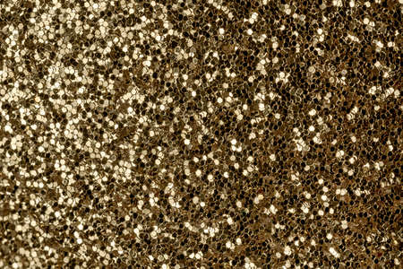 Gold, festive glitter background. Christmas photo for postcardsの写真素材