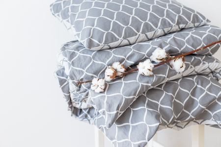 Modern grey bed linen pile, in trend, minimalism clean home conceptの写真素材