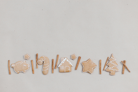 Christmas homemade gingerbread cookies in the line on craft paper background. Christmas bakery bannerの写真素材