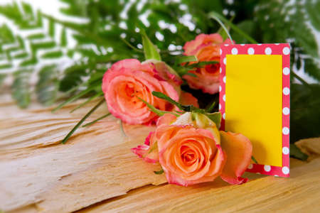 Colorful fresh roses flowers isolated on wood background and card.Motherの写真素材