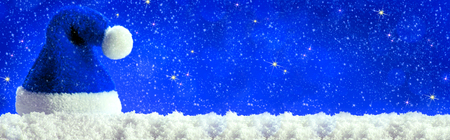 Christmas  blau background with Christmas hat. Blue santa hat.の写真素材