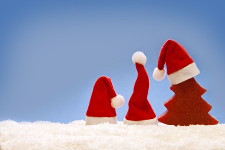 Christmas  blue  background with Santa hat.Cristmas decoration and santa hats.
