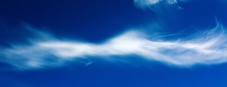 White fluffy clouds in the blue sky .Blue sky background.