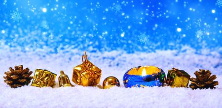 Christmas decoration isolated on blue background. Christmas decoration and advent candle.White snow.の写真素材