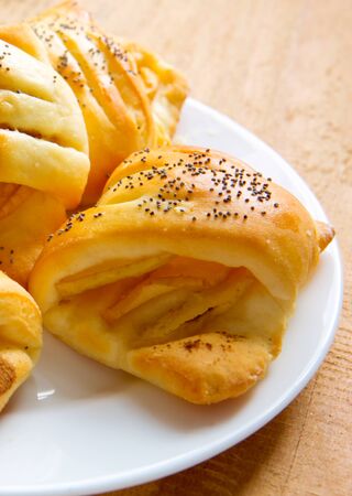 Slice of an apple strudel on on the plate .Homemade apple pie dessert on a wooden table closeup.の写真素材
