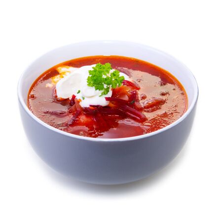 Ukrainian red soup borscht with sour cream, top view, isolated.の写真素材