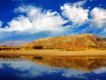 Beautiful landscape of summer lake and  mountains reflecting in water.の写真素材