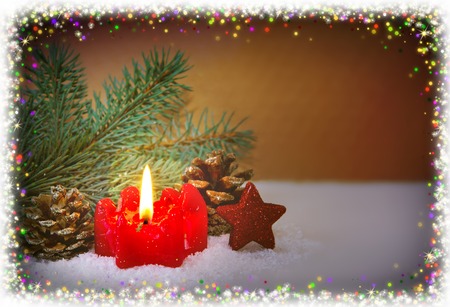 Christmas background with red advent candle and green fir tree bransh .Christmas decoration with frame.の写真素材