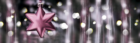 Christmas decoration with red Star isolated on gray bokeh background. Christmas background.