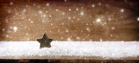 White snow and wood space. Old wood texture with snow flakes and star.の写真素材