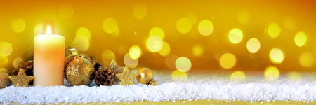 Christmas golden decoration and Advent candle.の写真素材