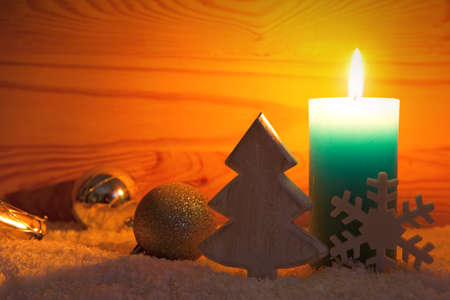 Christmas silver decoration and Advent candle. Christmas card.の写真素材