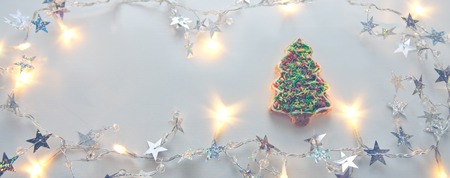 Christmas fir tree Cookie with garland isolated.の写真素材